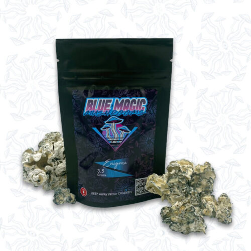 A sealed package of magic mushrooms behind a small pile of dried magic mushrooms